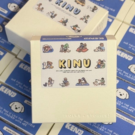Box with 'KINU' branding on a stack of similar boxes.